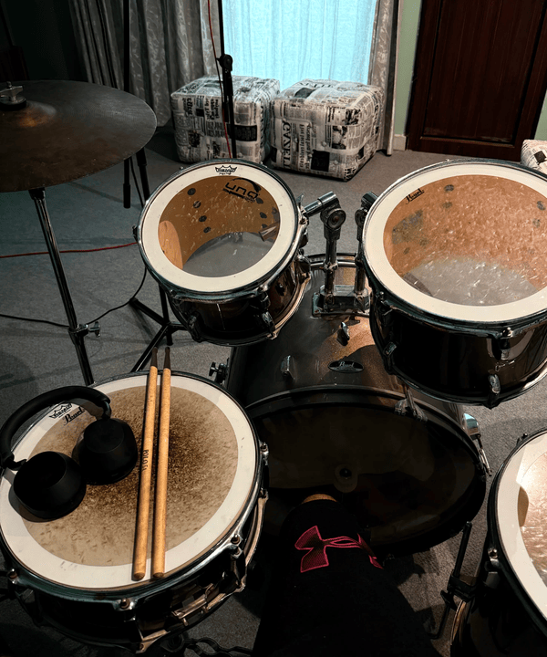 James’s drum kit with sticks resting on the snare